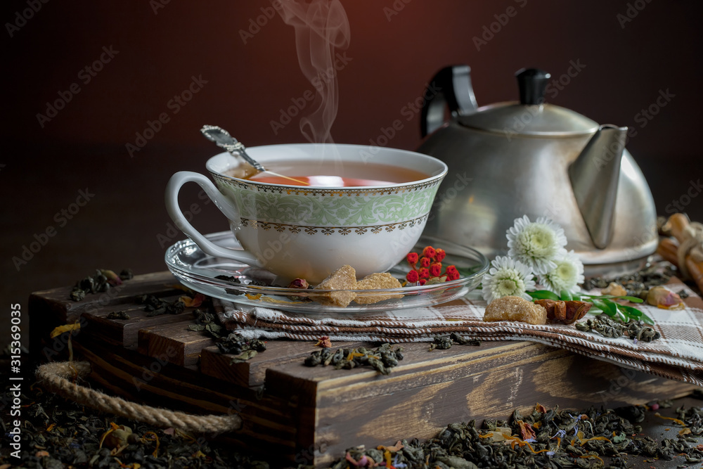 Tea hot drink on old background in composition on the table Tea hot drink on old background in composition on the table