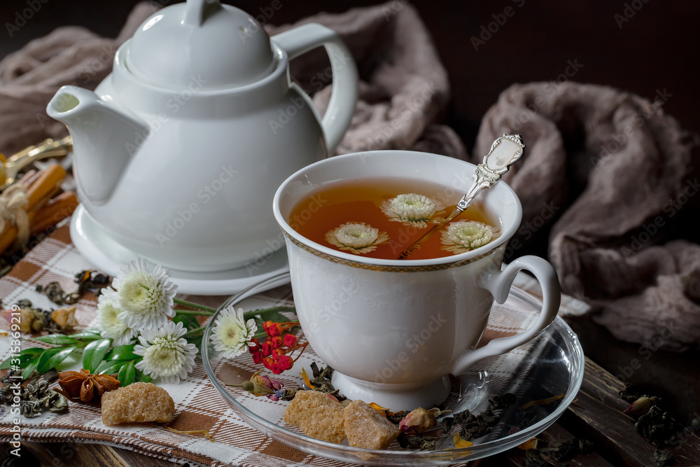 Tea hot drink on old background in composition on the table