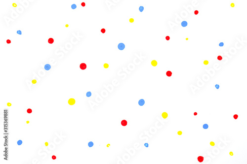 red blue yellow water colour random drop dots on white drawing paper with paper texture.