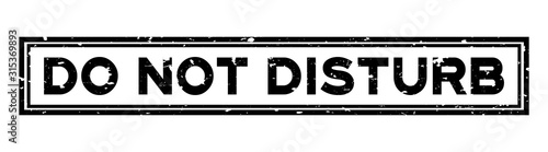 Grunge black do not disturb word square rubber seal stamp on white background