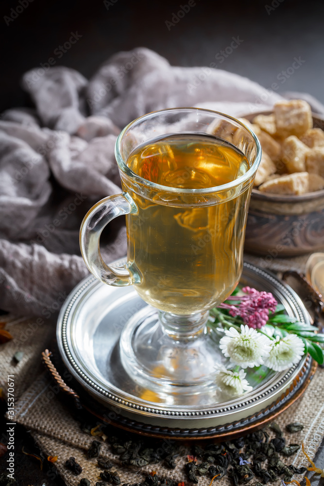 Tea in a cup on an old background Tea in a cup on an old background
