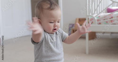 10 Month Old Baby Clapping and Smiling Happily at Camera