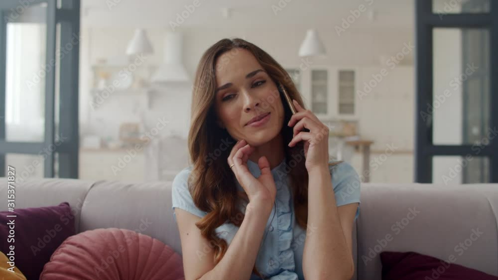 Closeup business woman talking friendly on cell phone at home office. Closeup business woman talking friendly on cell phone at home office.
