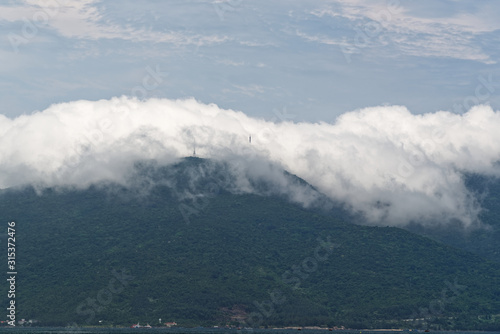Scenic view of clouds rolling over the mountain on Son Tra Peninsula. Da Nang in Central Vietnam