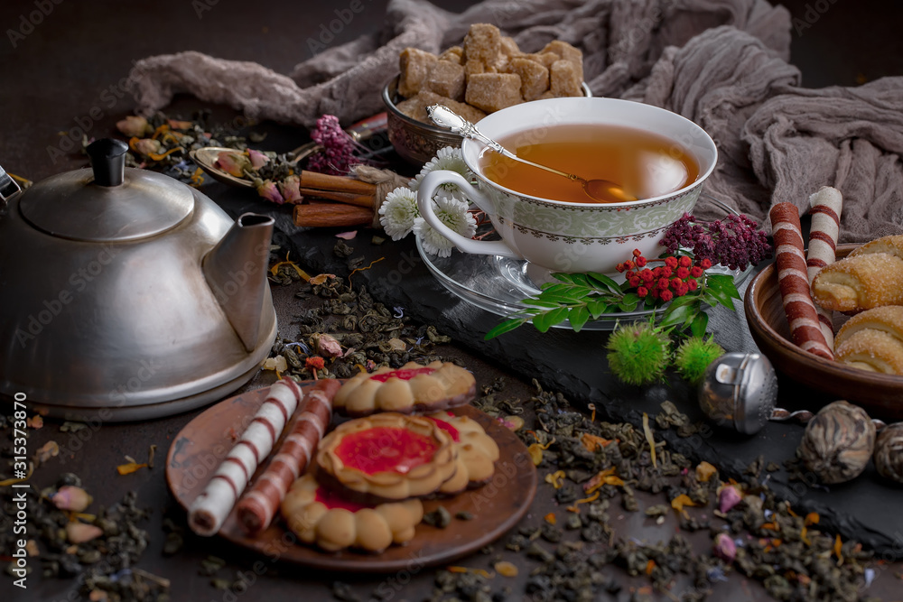 Tea hot drink on old background in composition on the table Tea hot drink on old background in composition on the table