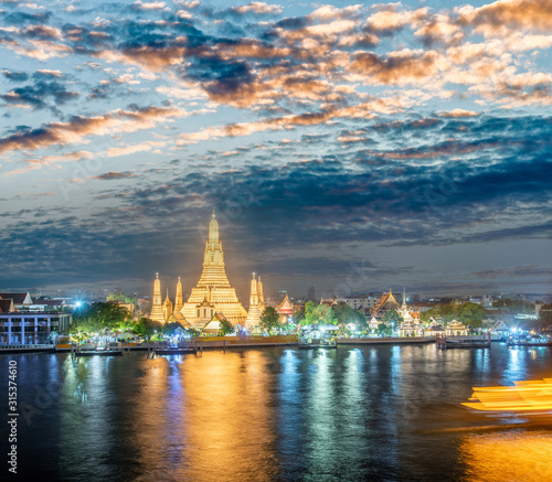 Night view of Wat Arun Ratchawararam temple. Beautiful sunset at Chao Phraya river, landmark thailand tourist spot, Bangkok - Thailand © jovannig