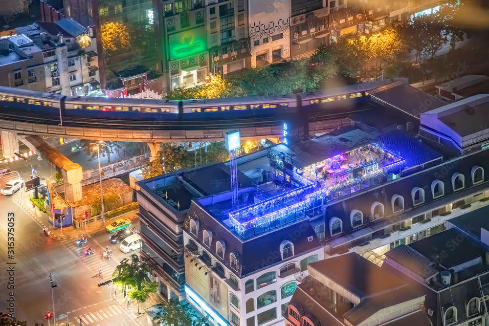Bangkok aerial night skyline with BTS railway