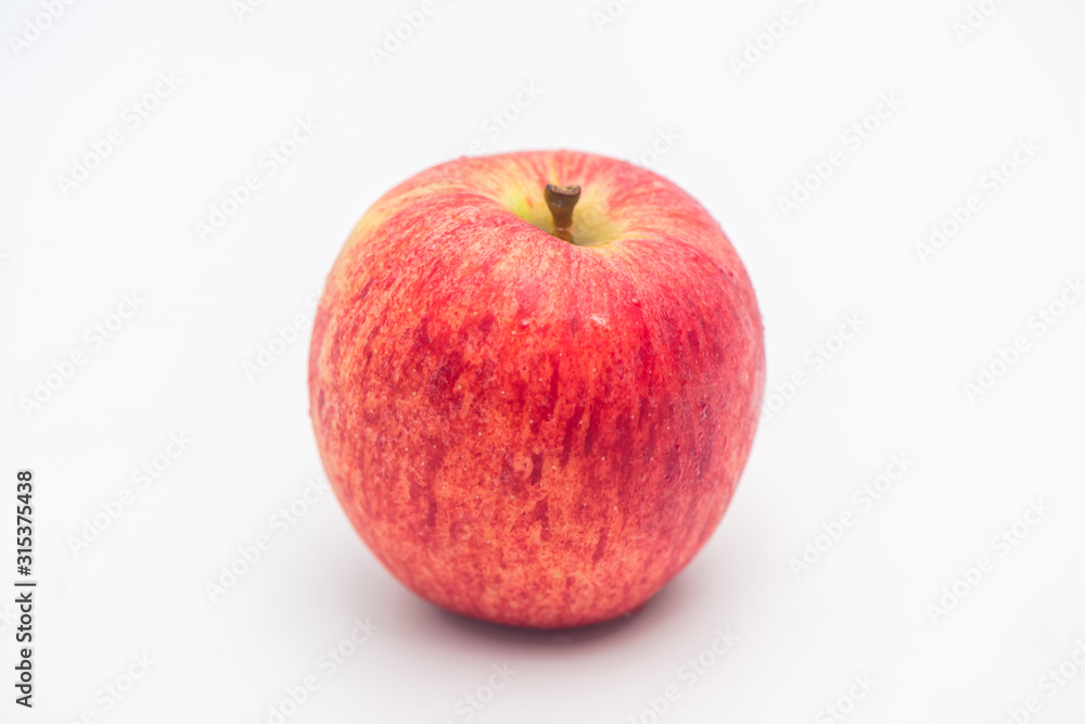 One GALA APPLE isolated on white background. One GALA APPLE isolated on white background.