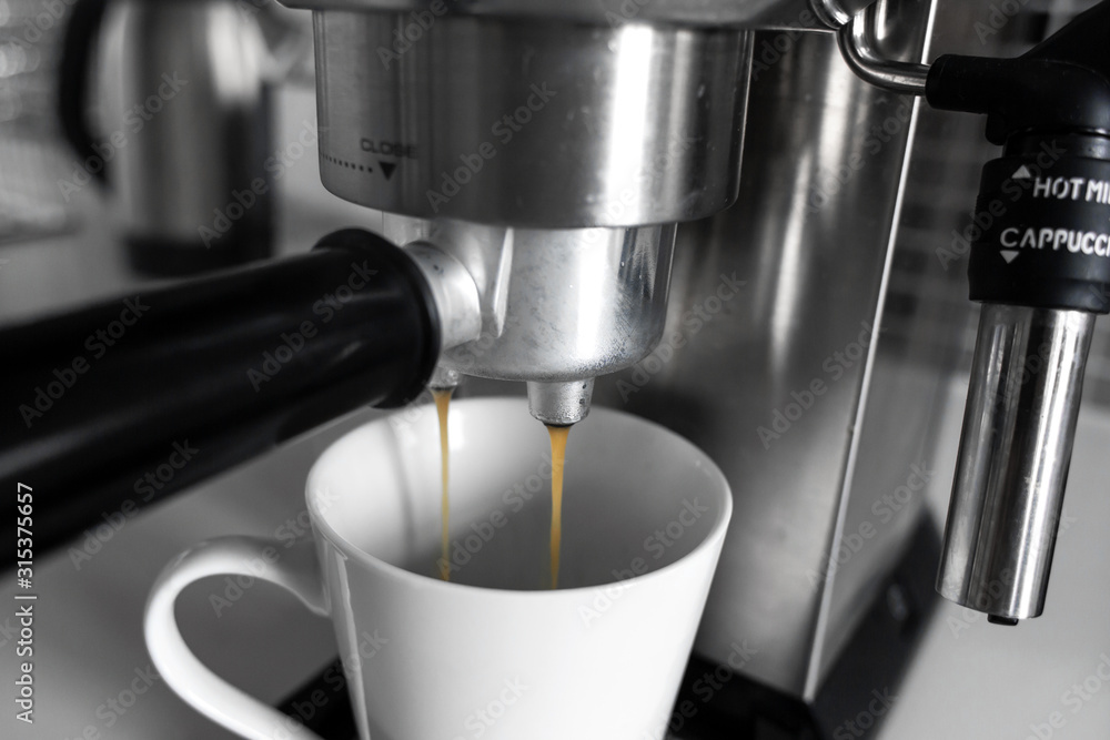 Close-up of making coffee in a coffee machine. Close-up of making coffee in a coffee machine.