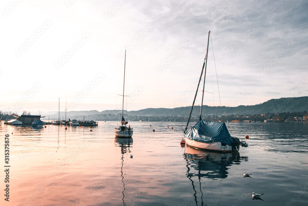 Sailboats At A Calm Beautiful Sunset At Lake Zurich. Sailboats At A Calm Beautiful Sunset At Lake Zurich.