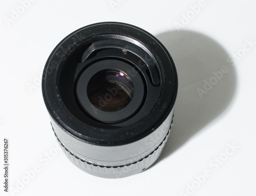an automatic tele convertor doubler lens adaptor to make longer focal lengths. Adding distance to existing lenses. lens adaptor isolated on a white studio background.
