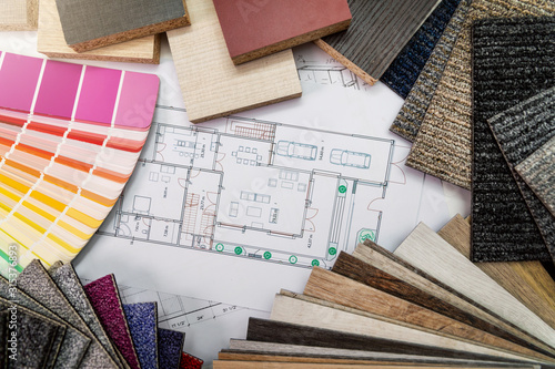 interior design materials and color samples with floor plan blueprint photo