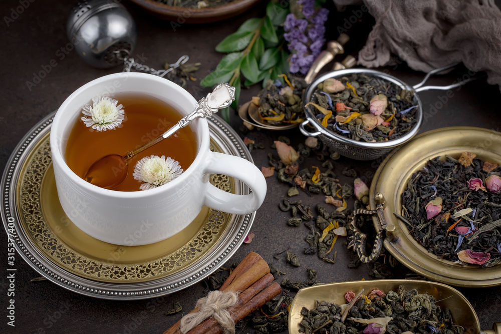 Tea hot drink on old background in composition on the table Tea hot drink on old background in composition on the table