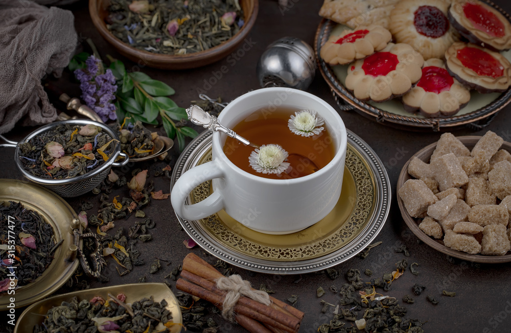 Tea hot drink on old background in composition on the table Tea hot drink on old background in composition on the table