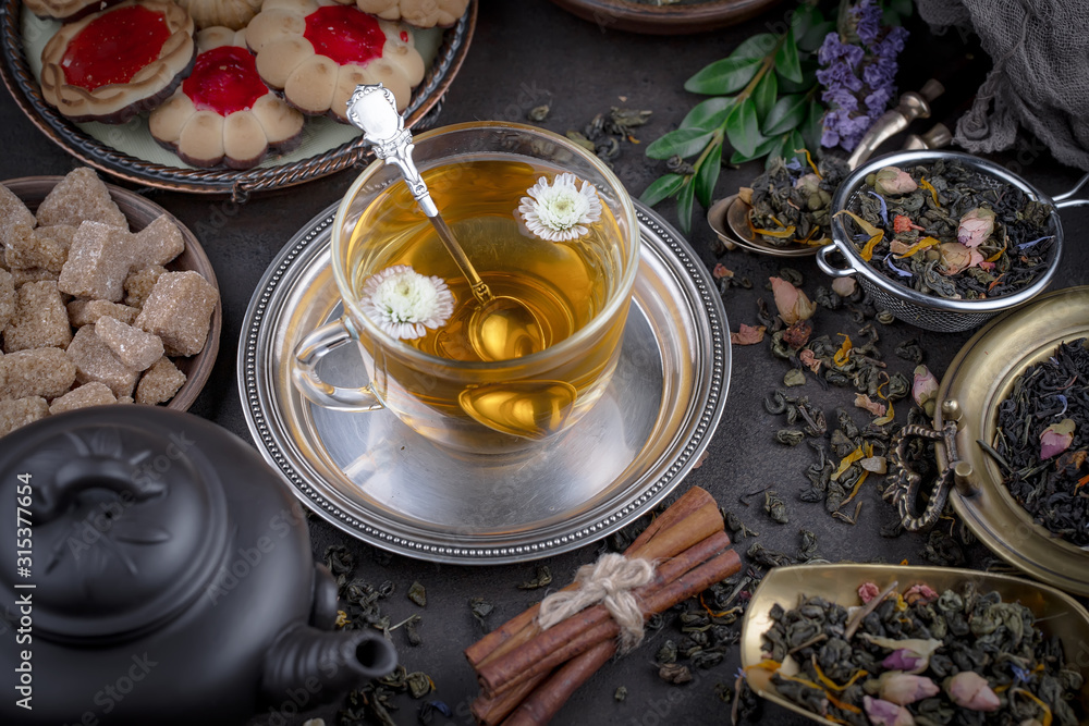 Tea hot drink on old background in composition on the table Tea hot drink on old background in composition on the table