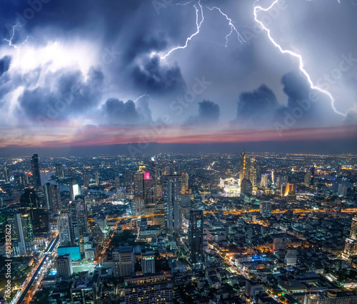 Aerial sunset view of Bangkok modern skyline during a storm, Thailand