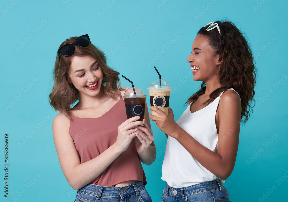 Coffee break, Happy women holding ice coffee on blue background. Coffee break, Happy women holding ice coffee on blue background.