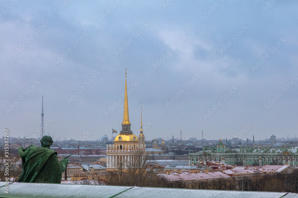Fototapeta premium Beautiful view of St. Petersburg from the observation deck of St. Isaac's Cathedral on a blue cloudy day.