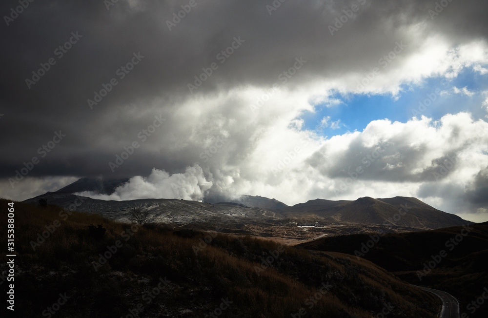 Scenery of Mount Aso actively blowing up volcanic smoke. View Smoke Gas Steam. Shot in Aso-Kuju National Park, Kumamoto,Japan. Scenery of Mount Aso actively blowing up volcanic smoke. View Smoke Gas Steam. Shot in Aso-Kuju National Park, Kumamoto,Japan.