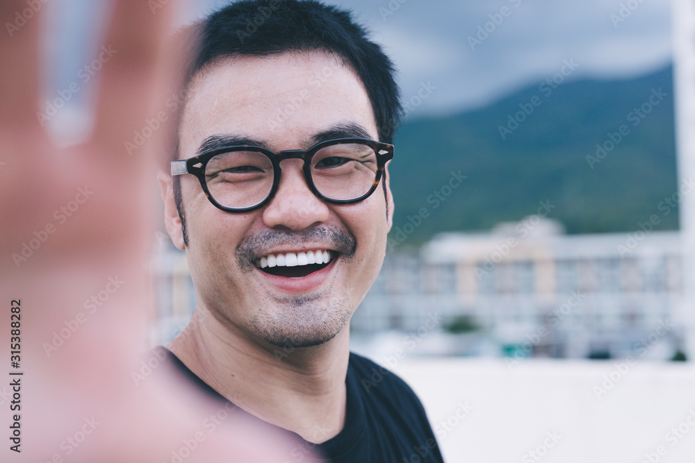 asian man smile happy enjoy taking a selfie while travelling on holiday.concept people travel outdoor adventure asian man smile happy enjoy taking a selfie while travelling on holiday.concept people travel outdoor adventure