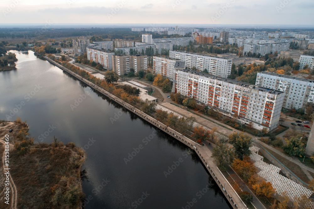 Aerial view of town in autumn at sunset. Energodar, Ukraine. The satellite city of Europe's most atomic power station. Aerial photography. Top view.