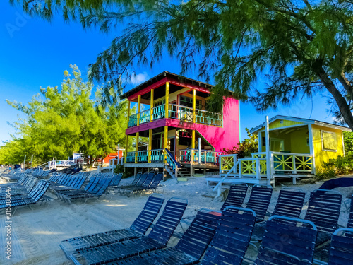 Colorful tropical cabanas or shelters on the beach of Half Moon Cay photo