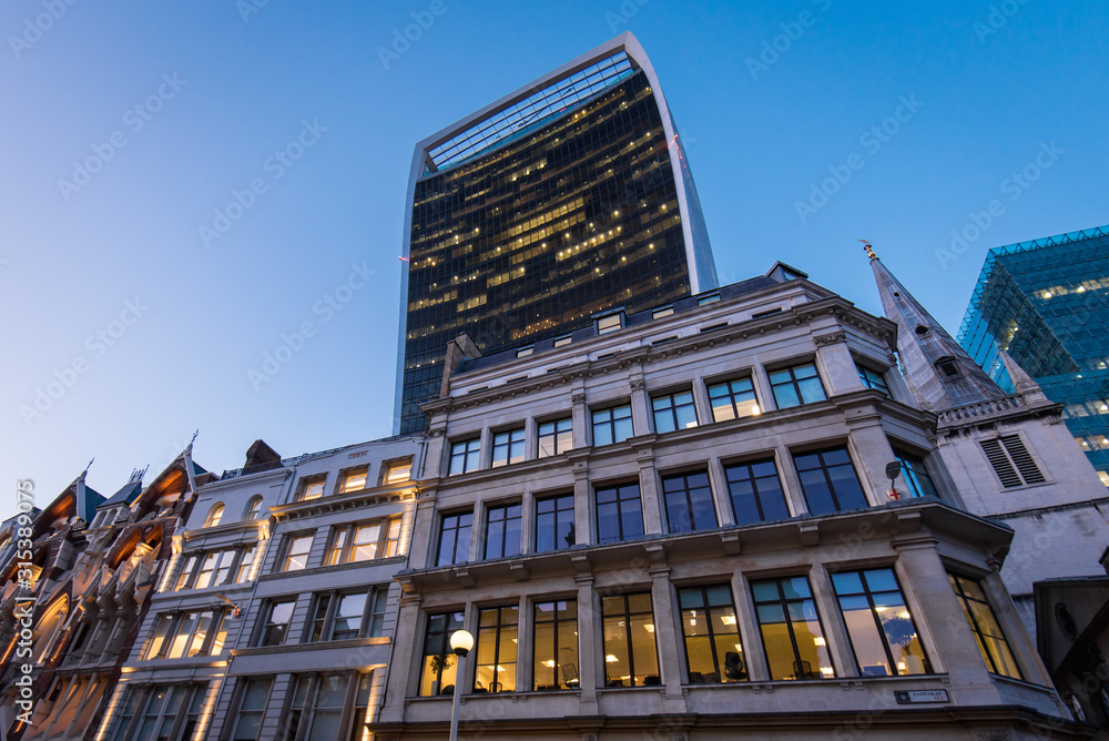 Walkie Talkie building rises high above older architecture British buildings in London