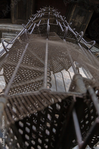 Circular iron staircase at St. Isaac's Cathedral on a winter cloudy day. photo