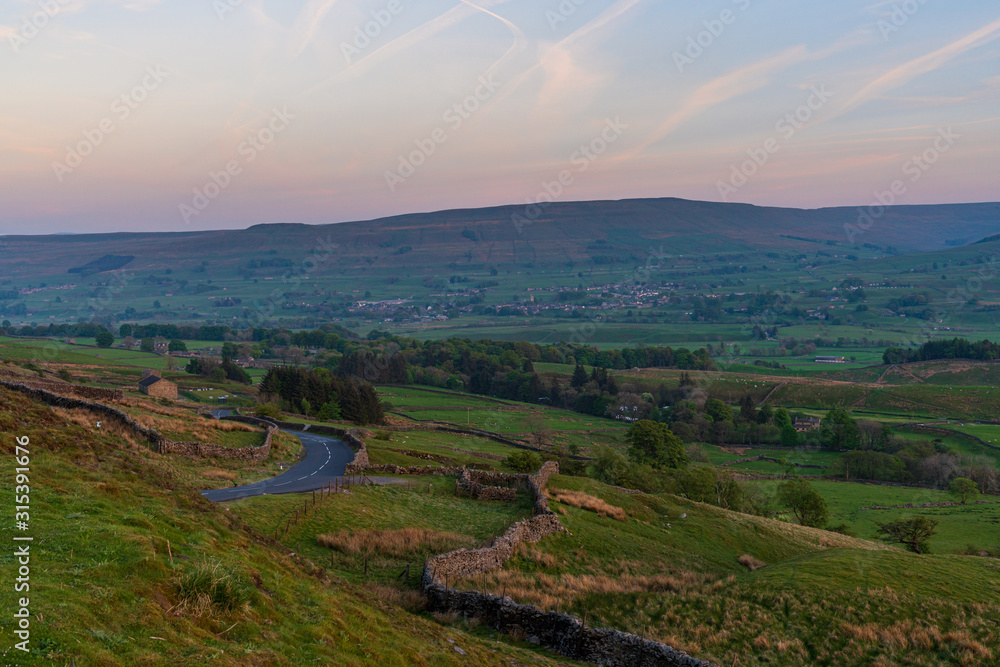 View at the Yorkshire Dales landscape from the Buttertubs Pass (Cliff Gate Rd) between Thwaite and Simonstone, North Yorkshire, England, UK View at the Yorkshire Dales landscape from the Buttertubs Pass (Cliff Gate Rd) between Thwaite and Simonstone, North Yorkshire, England, UK