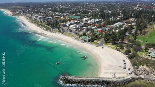 4k Smooth drone footage over beautiful Cottesloe beach in Fremantle, Perth Australia on a warm summer day photo