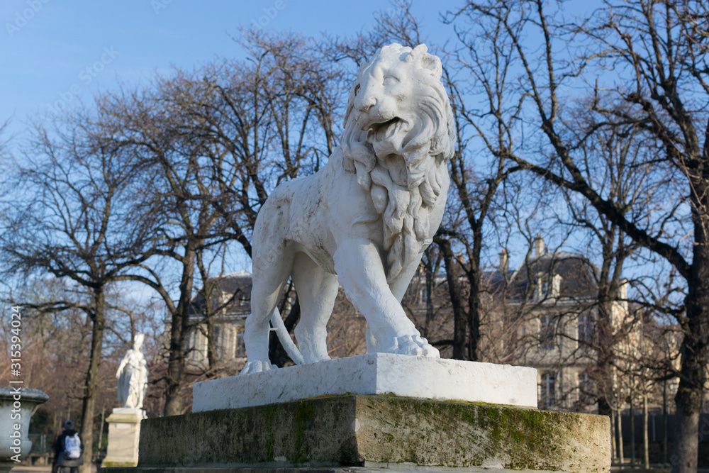 PARIS, FRANCE - DECEMBER 31, 2019: Luxembourg Gardens lion statue PARIS, FRANCE - DECEMBER 31, 2019: Luxembourg Gardens lion statue