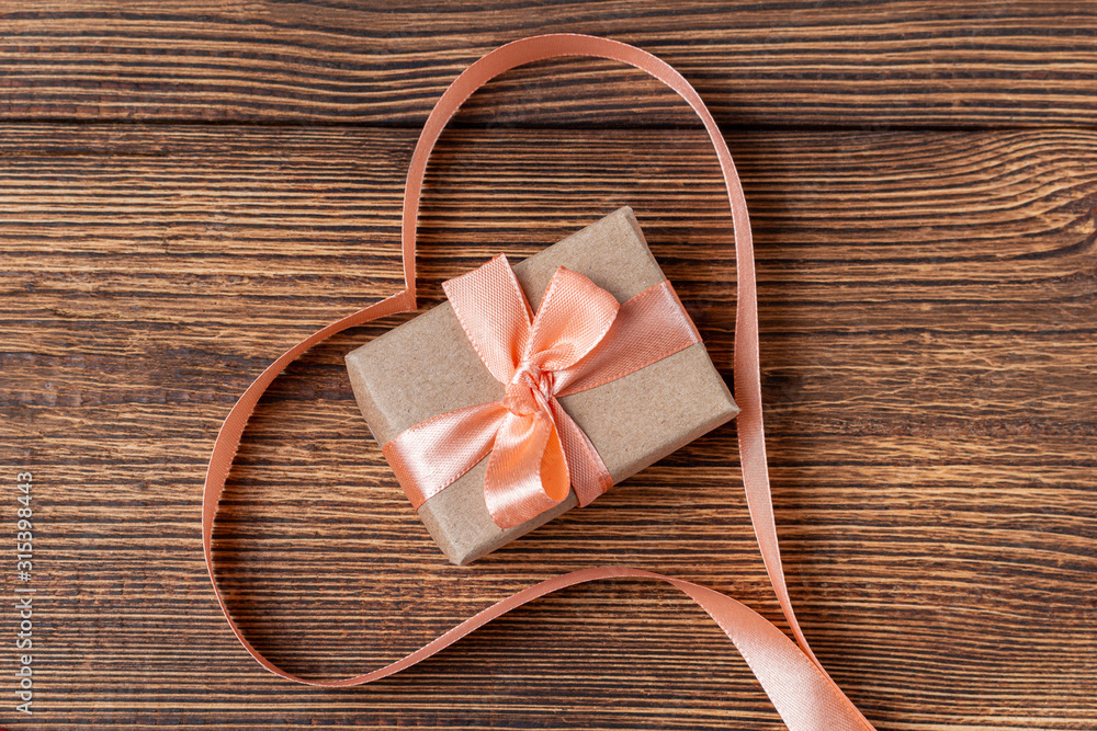 Heart shaped ribbon on a wooden background. Valentine's Day Gift card Heart shaped ribbon on a wooden background. Valentine's Day Gift card