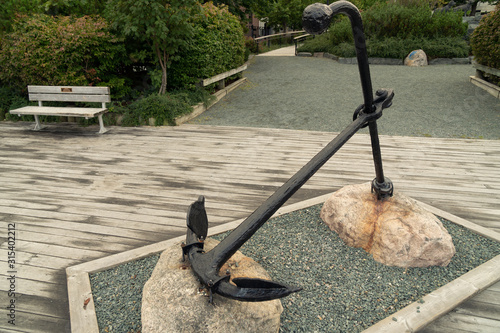 A ship anchor tribute to the marine heritage of the island and memorial to its many lost sailors, Harbourside Park, St. John's, Newfoundland photo