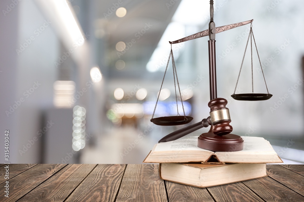 Justice Scales and books and wooden gavel on table. Justice concept Justice Scales and books and wooden gavel on table. Justice concept