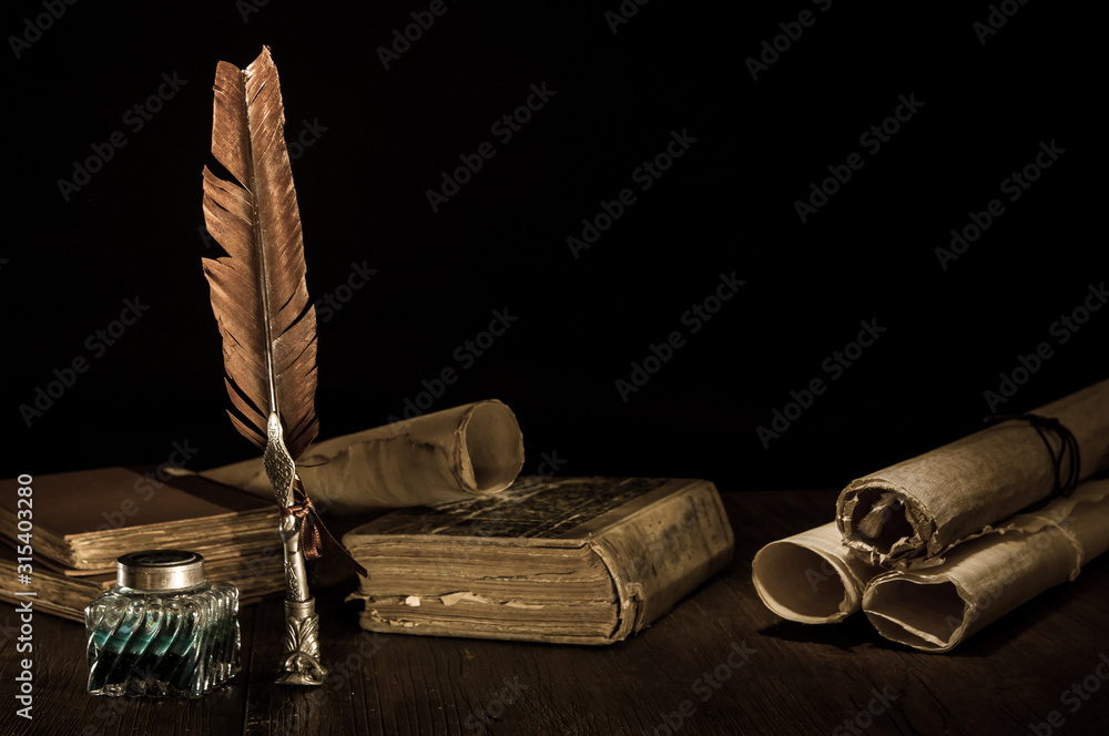 Quill pen and rolled up papyrus sheets with old books, vintage effect Stock  Photo | Adobe Stock