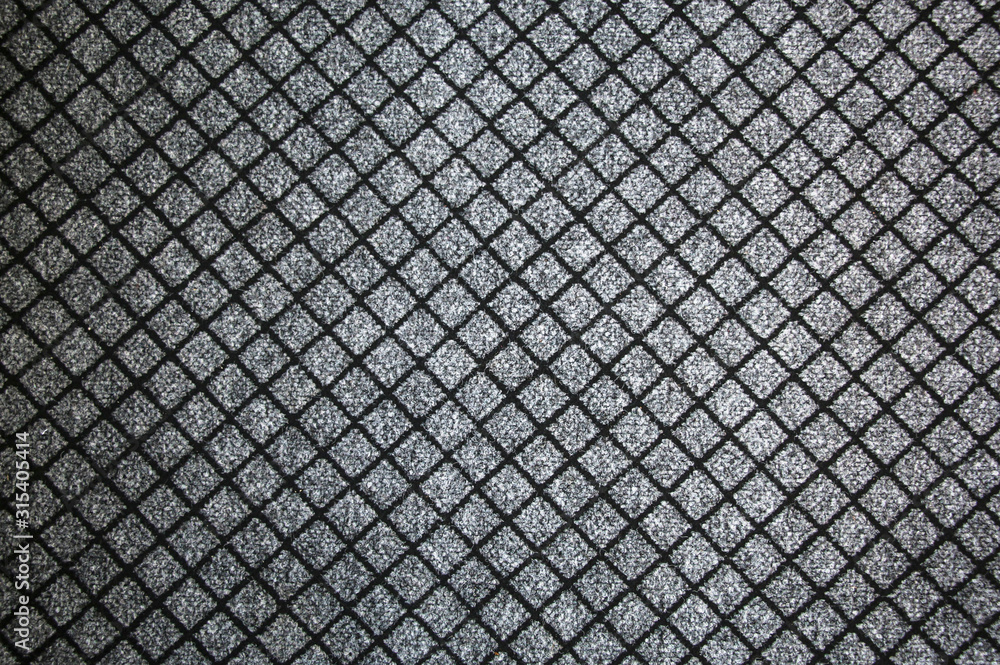 Texture of textile rug with pattern of white and gray colors Texture of textile rug with pattern of white and gray colors