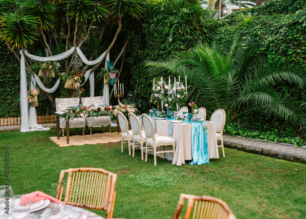 Decoration for open air wedding ceremony with dinner table in blue and ...