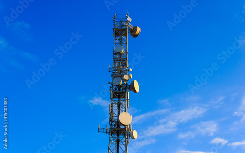 Mobile communication tower/tower with  control devices and antennas, transmitters and repeaters for mobile communications and the Internet