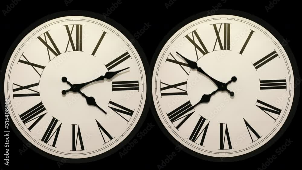 Video Stock Two identical timelapse clock faces one going forward and