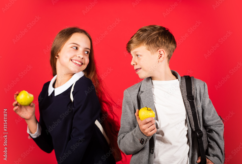 Its break time. Small kids eat apples for meal break. Happy children enjoy school break. Little girl and boy have snack break in school. Natural food. Healthy snack. Health and diet Its break time. Small kids eat apples for meal break. Happy children enjoy school break. Little girl and boy have snack break in school. Natural food. Healthy snack. Health and diet