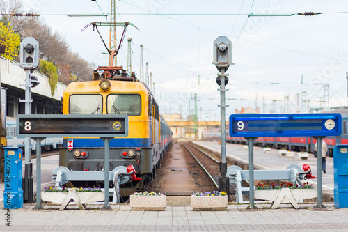Canvas Print Railways passenger trains in Budapest railway station in summer