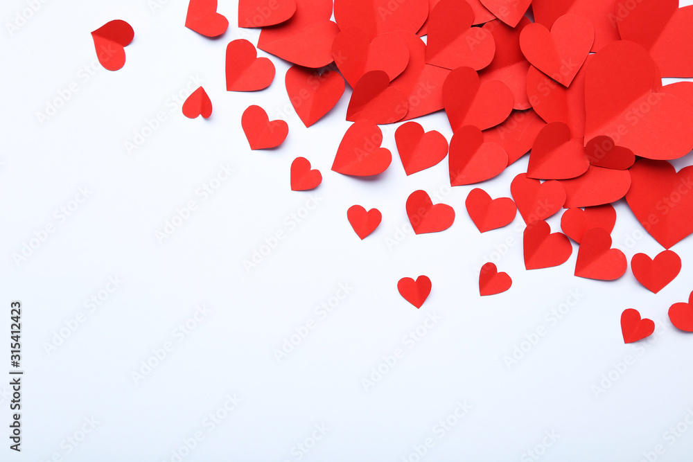 Red paper hearts on grey background Red paper hearts on grey background