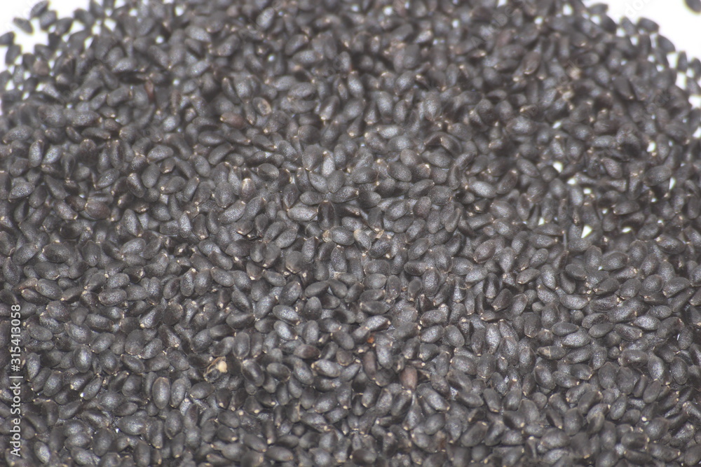 pile of basil seeds tukmaria spice macro as background pile of basil seeds tukmaria spice macro as background