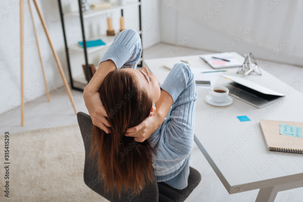 © LIGHTFIELD STUDIOS - selective focus of dreamy girl chilling near table at home © LIGHTFIELD STUDIOS - selective focus of dreamy girl chilling near table at home
