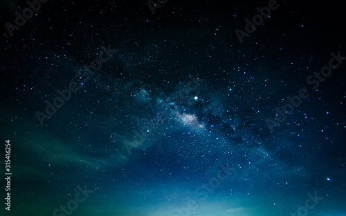 Milky way galaxy with stars and space in the universe background at thailand