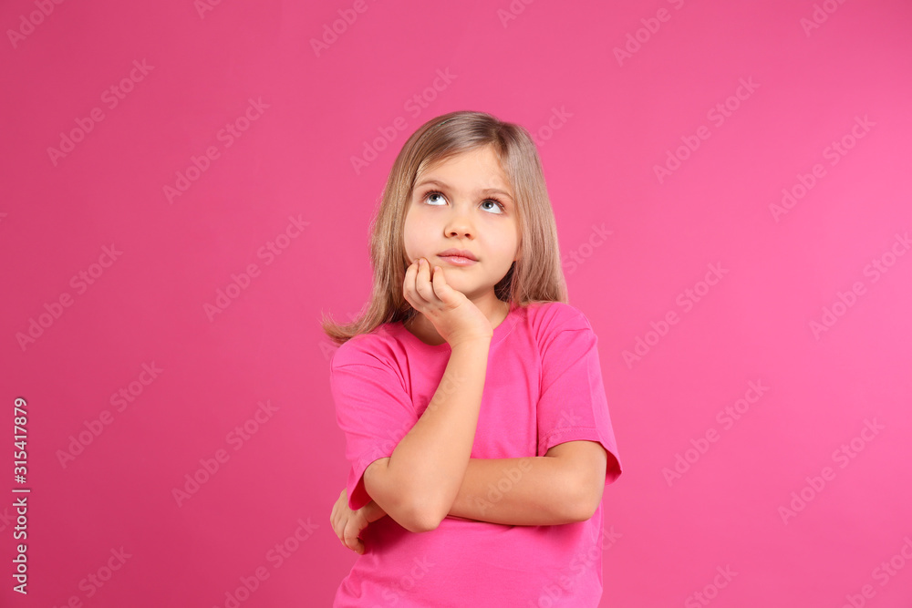 Thoughtful little girl wearing casual outfit on pink background - obrazy, fototapety, plakaty 