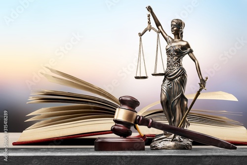 Sculpture justice bronze lady and open books and gavel photo
