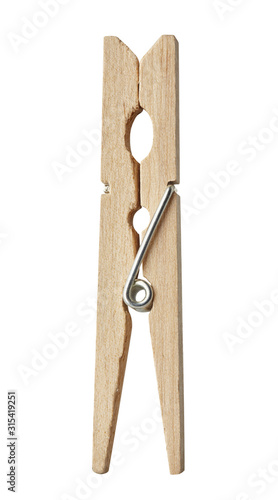 Wooden clothes pin isolated on a white background. Close up.