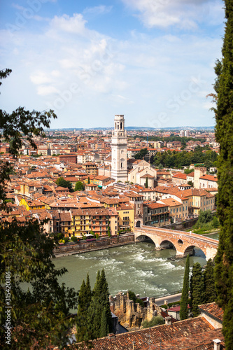Italy, Verona,?Ponte Pietra bridge and surrounding city buildings photo