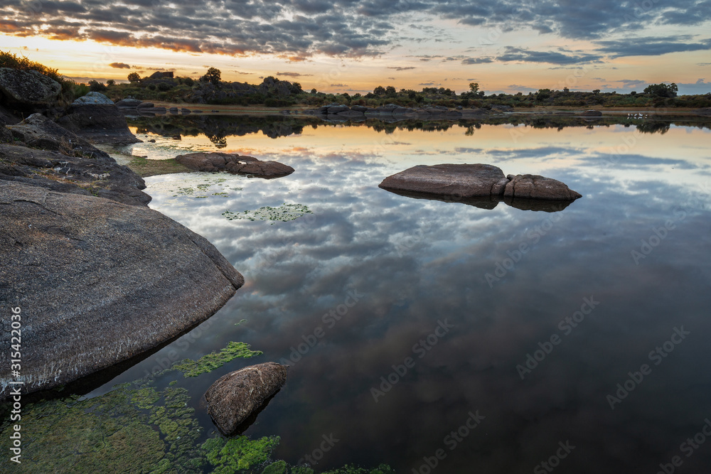 Sunrise in the Natural Area of Barruecos. Malpartida de Caceres. Extremadura. Spain. Sunrise in the Natural Area of Barruecos. Malpartida de Caceres. Extremadura. Spain.